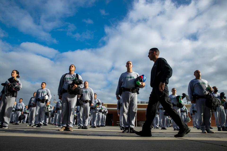 Recruits assemble after a grueling defensive tactics class at STARS Center in Whittier.