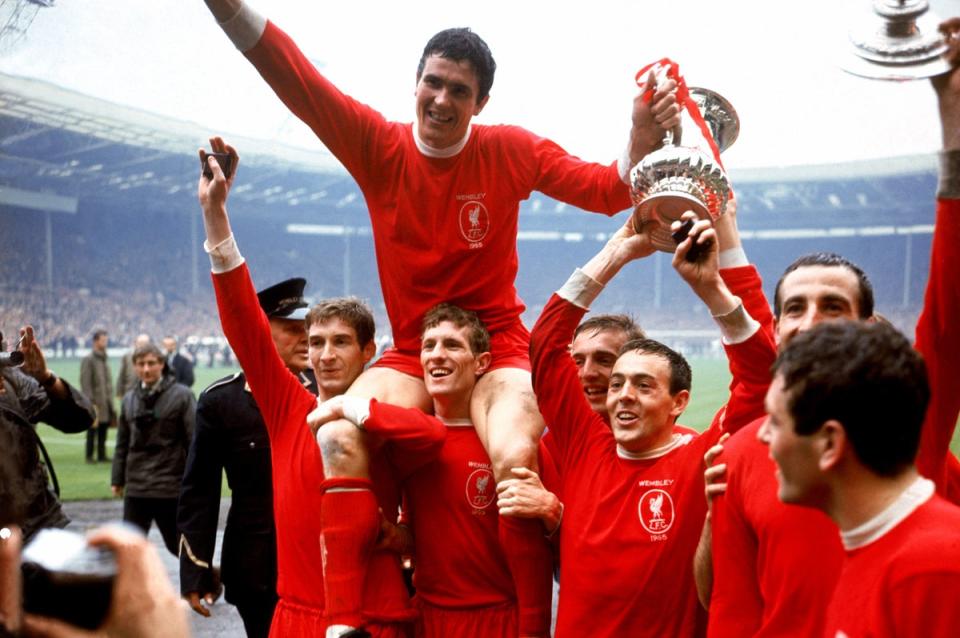 Champion: Yeats holds the FA Cup aloft after a thrilling win against Leeds in 1965 (PA)