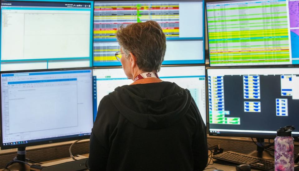 Austin police dispatcher Valerie Padier keeps her eyes on her screens Thursday at the communications center. In the city, a dispatcher can work as a 911 call taker, but a call taker can’t be a dispatcher.