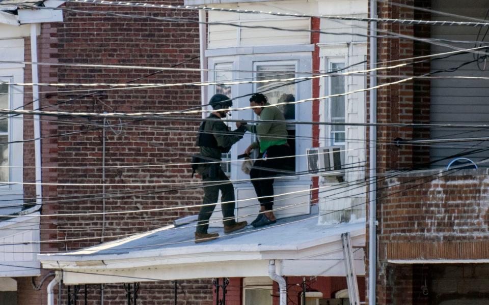 Police help victims out of the shooting scene