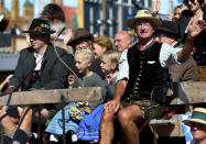 People in traditional costumes take part in a parade as part of the opening of the 186th 'Oktoberfest' beer festival in Munich, Germany, Saturday, Sept. 21, 2019. (AP Photo/Matthias Schrader)