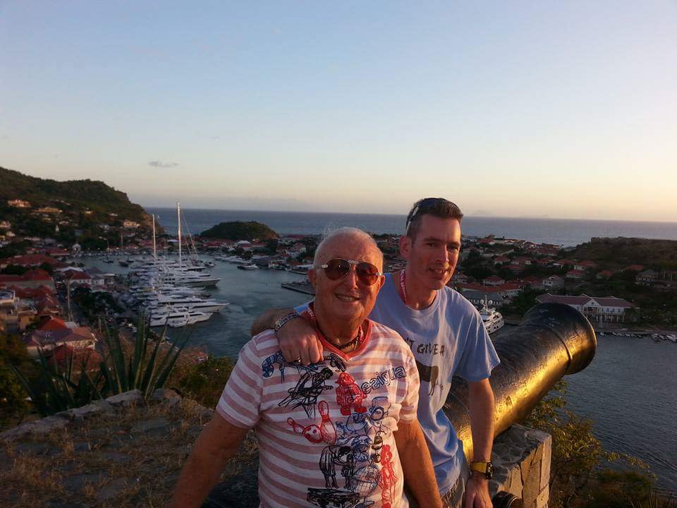 Herb and John Diamond-Ring during a sunset in front of a bay with yachts.