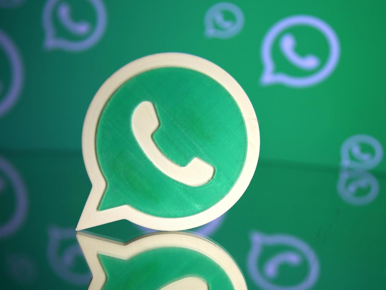 A 3D printed Whatsapp logo is seen in front of a displayed Whatsapp logo in this illustration September 14, 2017: REUTERS/Dado Ruvic