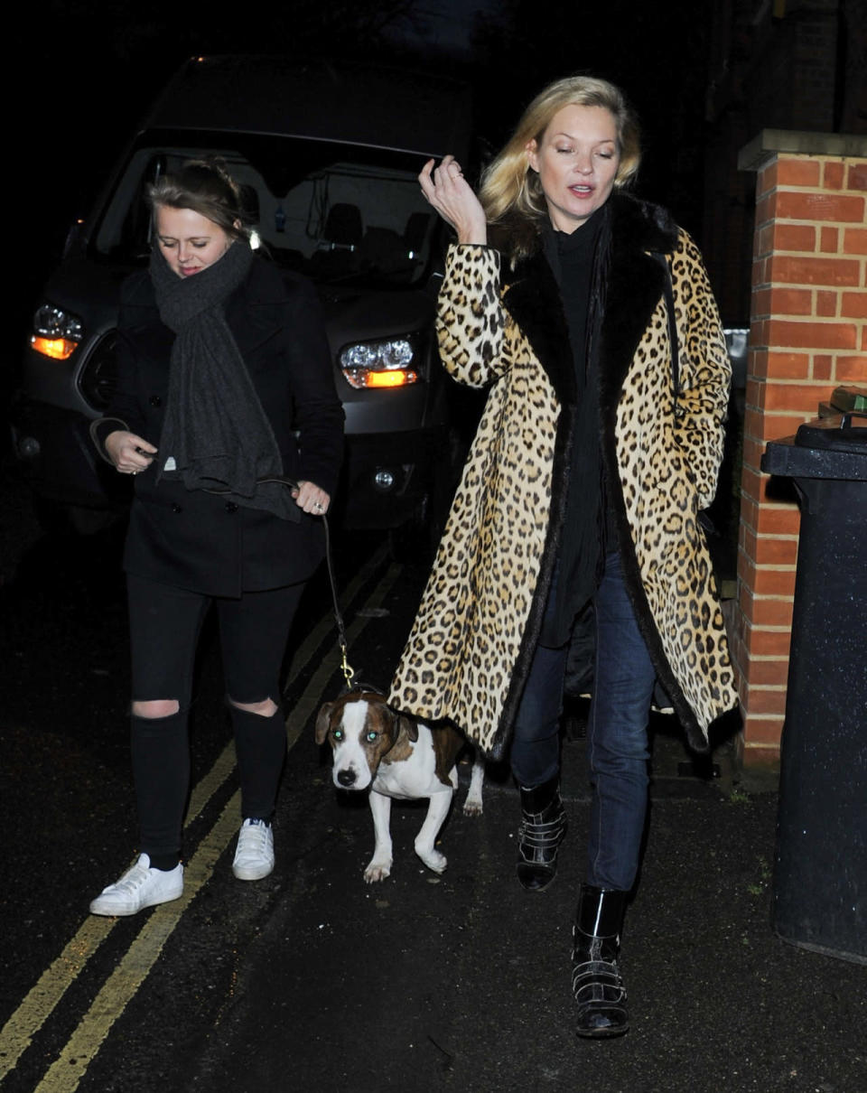 Kate Moss wears her trusty leopard coat and skinny jeans on a late-night walk in London.
