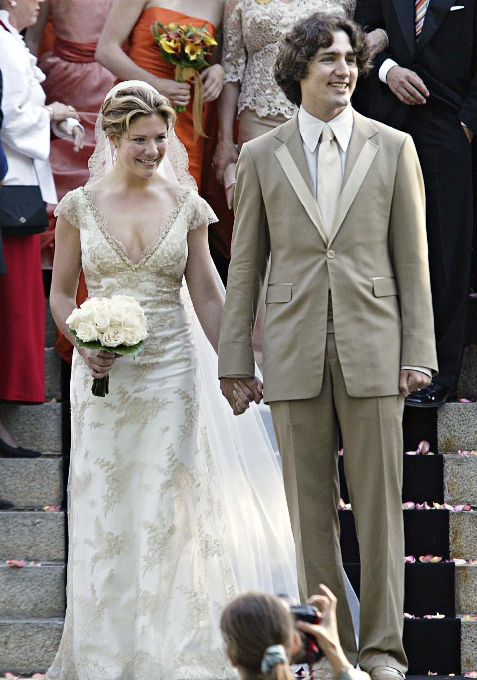 Trudeau wore a tan-coloured suit, to which Grégoire Trudeau matched her new husband with an elegant gown created by a local boutique in Montreal called Les Noces Couture. (CP PHOTO/Ryan Remiorz)