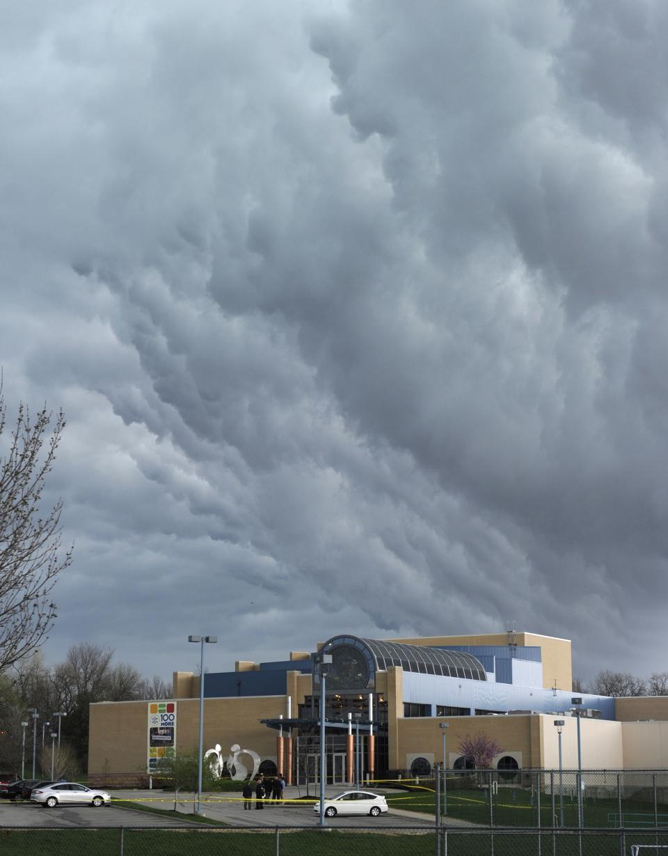 Storm clouds build over the scene of a shooting at the Jewish Community Center of Greater Kansas City in Overland Park, Kansas April 13, 2014. (REUTERS/Dave Kaup)