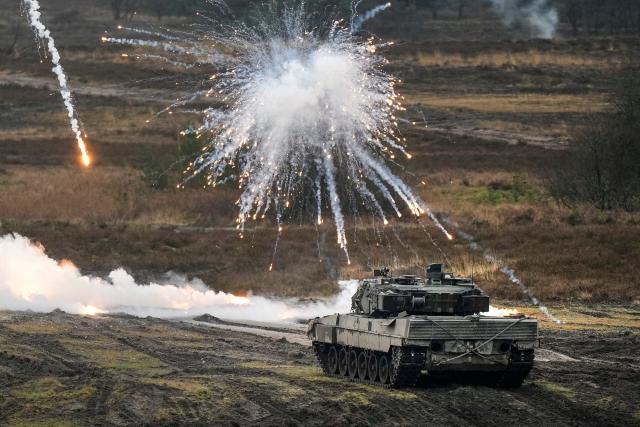 A Leopard 2 tank is seen in action at the Bundeswehr tank battalion 203 at the Field Marshal Rommel Barracks in Augustdorf, Germany, Wednesday, Feb. 1, 2023.