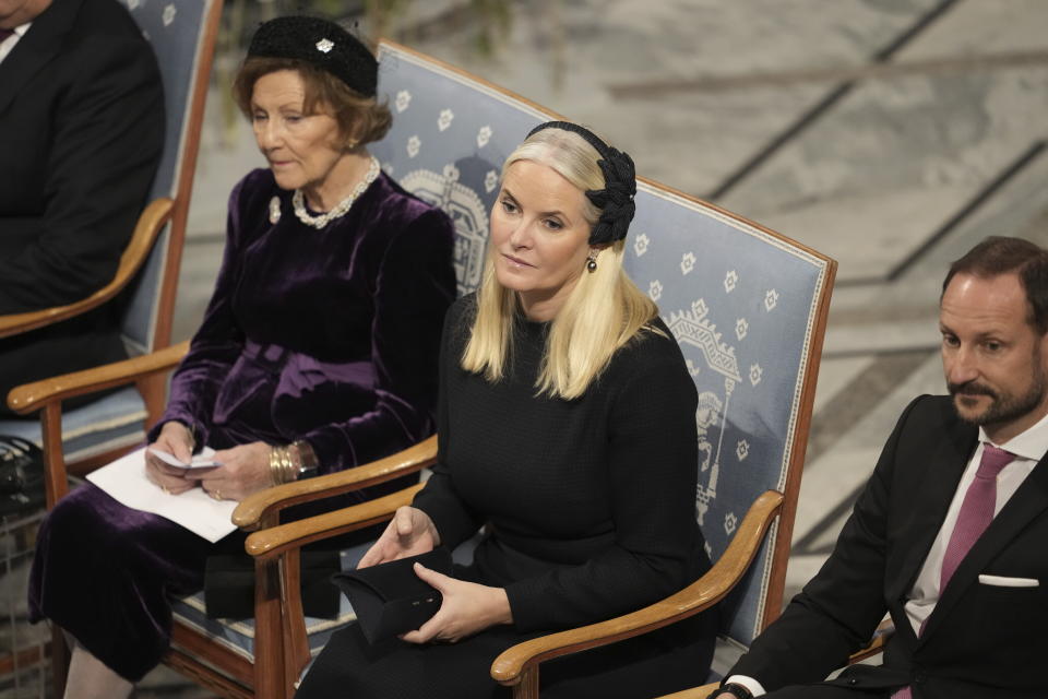 Norway's Queen Sonja, Crown Prince Haakon, right, and Crown Princess Mette-Marit, center, attend the awarding of the Nobel Peace Prize for 2023 in Oslo City Hall, Oslo, Norway, Sunday, Dec. 10, 2023. The children of imprisoned Iranian activist Narges Mohammadi are set to accept this year’s Nobel Peace Prize on her behalf. Mohammadi is renowned for campaigning for women’s rights and democracy in her country. (Fredrik Varfjell/NTB via AP)