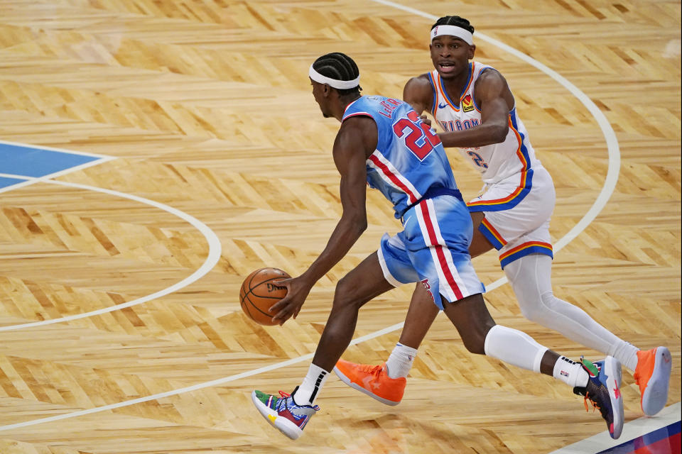 Oklahoma City Thunder guard Shai Gilgeous-Alexander (2) defends against Brooklyn Nets guard Caris LeVert (22) during the first quarter of an NBA basketball game, Sunday, Jan. 10, 2021, in New York. (AP Photo/Kathy Willens)