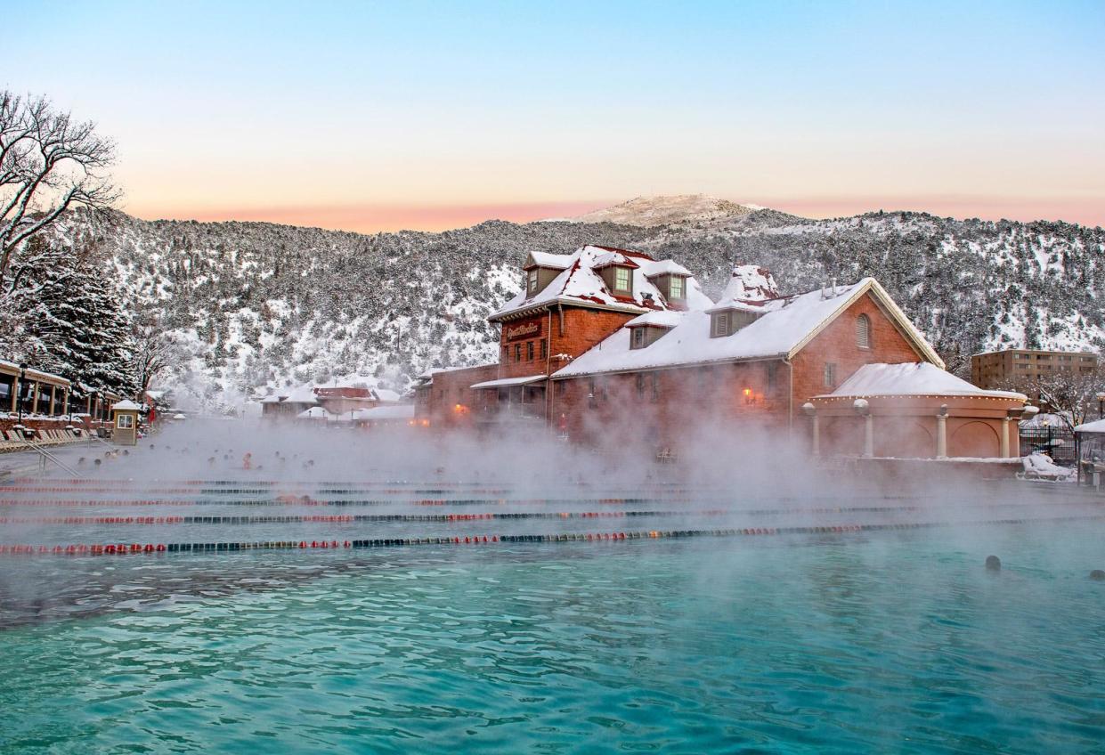 Snow blankets the mountains around Glenwood Hot Springs Resort.