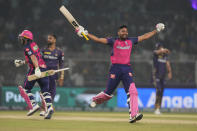 Rajasthan Royals' Jos Buttler and Avesh Khan celebrate their win against Kolkata Knight Riders during the Indian Premier League cricket match in Kolkata, India, Tuesday, April 16, 2024. (AP Photo/Bikas Das)