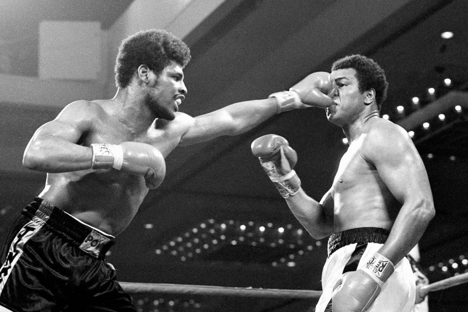 FILE- In this Feb. 15, 1978, file photo, the fist of challenger Leon Spinks flattens the nose of heavyweight champion Muhammad Ali during their title fight at Las Vegas. Former heavyweight champion Leon Spinks Jr. died Friday night, Feb. 5, 2021, after battling prostate and other cancers. He was 67. (AP Photo/File)