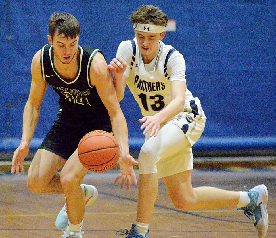 Clark-Willow Lake's Cole Heiman (left) steals the ball from Great Plains Lutheran's Alex Heil during their high school boys basketball game on Monday, January 23, 2023 in Watertown.