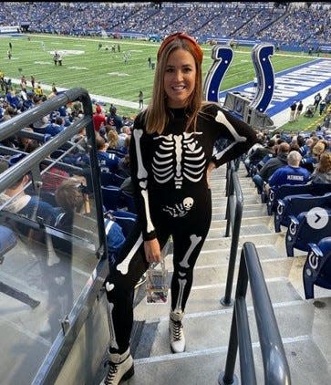 Emma Kelly at the Colts game on Halloween 2021 where they revealed the good news. They were having a baby.