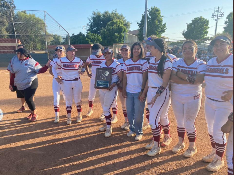 Members of the Santa Paula High softball team are presented with the regional finalist plaque after Saturday's 6-3, 10-inning loss to visiting Holtville in the CIF-State Division IV Southern California regional final.