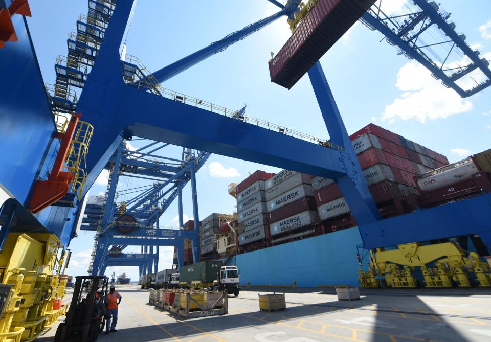 Longshoremen and stevedores load containers using the new neo-Panamax cranes onto the Maersk TP10 at the Port of Wilmington in Wilmington, N.C., Thursday August 9, 2018.