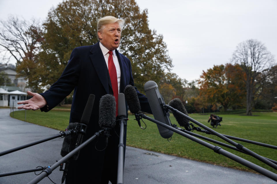 President Donald Trump talks with reporters before departing for France on the South Lawn of the White House, Friday, Nov. 9, 2018, in Washington. (AP Photo/Evan Vucci)