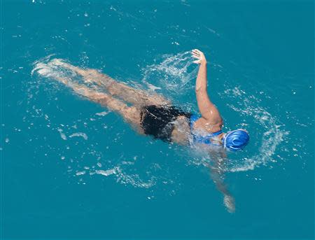 Diana Nyad, positioned about than two miles off Key West, Florida in this September 2, 2013 handout photo, swims towards the completion of her 111-mile trek from Cuba to the Florida Keys. REUTERS/Andy Newman/Florida Keys News Bureau/Handout via Reuters