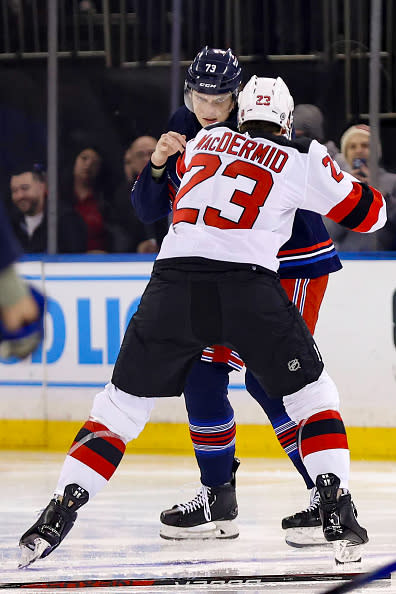 NEW YORK, NY – APRIL 03: New York Rangers Right Wing Matt Rempe (73) and New Jersey Devils Winger Kurtis MacDermid (23) fight before the opening face-off in the National Hockey League game between the New Jersey Devils and the New York Rangers on April 4, 2024 at Madison Square Garden in New York, NY. (Photo by Joshua Sarner/Icon Sportswire via Getty Images)