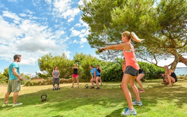 A kettle bell session in progress on the lawn at Sol Beach House, Ibiza - Andrei Oprescu