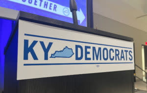  Podium with Kentucky Democratic Party’s logo at June 14 Forward Together even in Louisville. (Kentucky Lantern photo by McKenna Horsley)