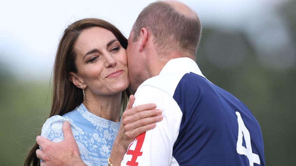 Prince William kisses Kate at a polo match