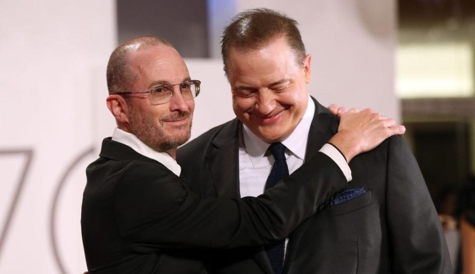 Darren Aronofsky and Brendan Fraser hug on the red carpet