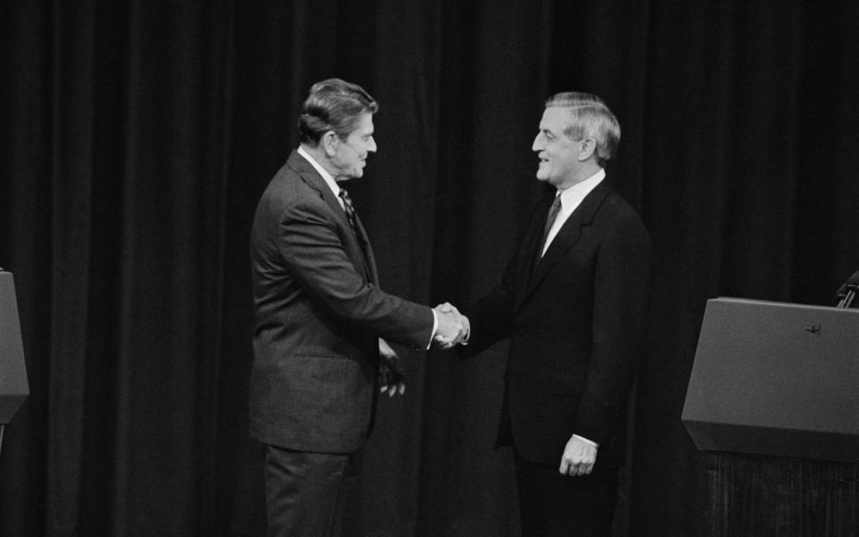 President Reagan and Walter Mondale shake hands before an election debate in 1984: Reagan taunted Mondale saying that he would not hold his 'youth and inexperience against him' - Joe Marquette/ Corbis