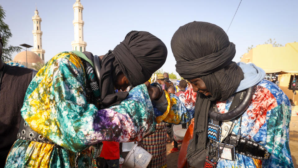 Two Baye Fall members greet each other in Diourbel, Senegal - Friday 5 April 2024