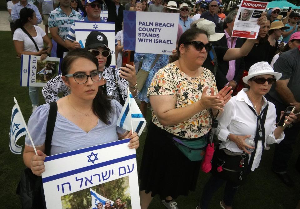 Demonstrators listen to speakers Sunday afternoon at a pro-Israel rally in West Palm Beach.
