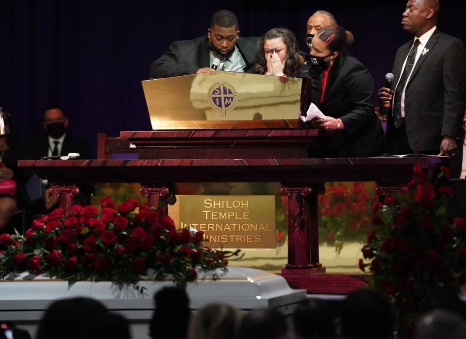 Katie Wright, mother of Daunte Wright, center, at her sons funeral.