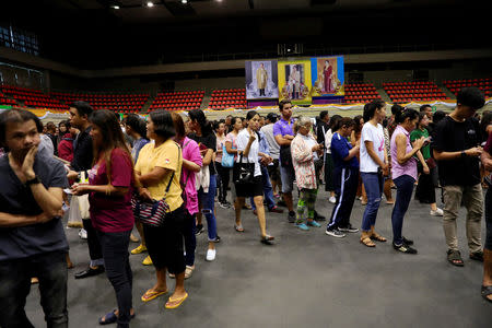 People line up for their early vote for the upcoming Thai election at a polling station in Bangkok, Thailand, March 17, 2019. REUTERS/Soe Zeya Tun