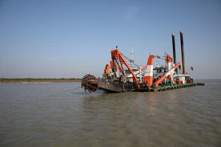 A dredging machine is seen near the Vashan Char, previously known as Thengar Char island, in the Bay of Bengal, Bangladesh February 14, 2018. Picture taken February 14, 2018. REUTERS/Stringer