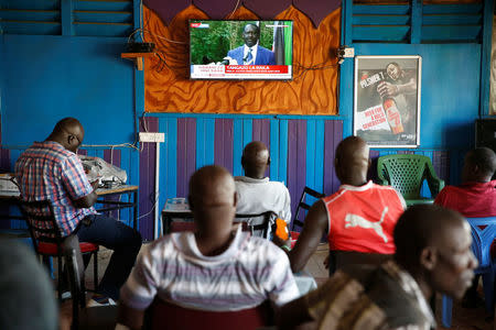 People sitting in a bar watch Kenyan opposition leader of the National Super Alliance (NASA) coalition Raila Odinga's news conference in Kisumu, Kenya October 31, 2017. REUTERS/Baz Ratner