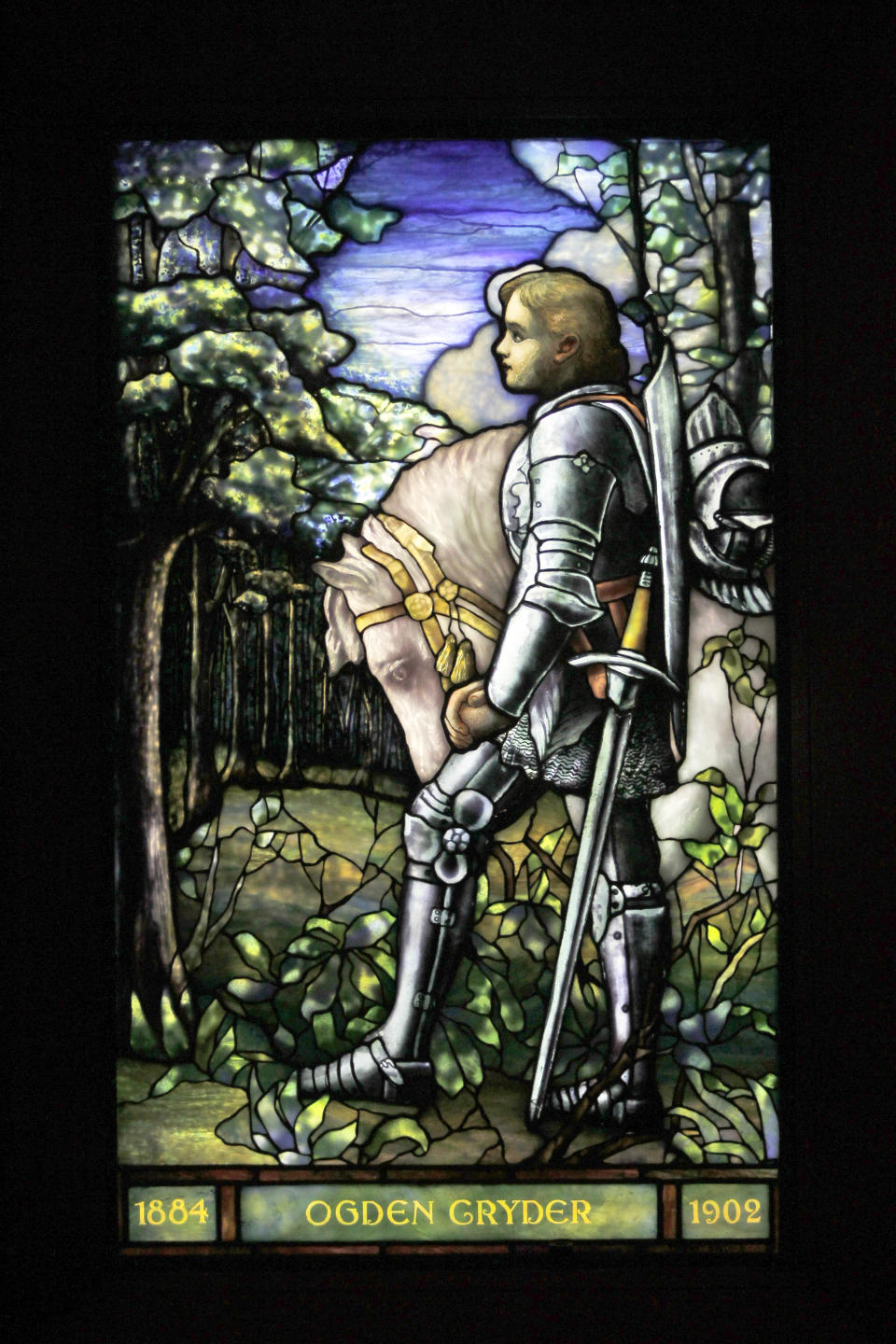 In this Thursday, Oct. 25 2012 photo, Sir Galahad, Cryder Memorial Window, from St. Andrew’s Dune Church, Southampton, N.Y., appears on display at the "Louis C. Tiffany and the Art of Devotion" exhibit at the Museum of Biblical Art in New York. (AP Photo/Mary Altaffer)