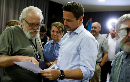 Rafal Trzaskowski, Civic Coalition (Civic Platform (Platforma Obywatelska) and Modern (Nowoczesna) coalition) candidate for mayor of Warsaw speaks with people during his election meeting in Warsaw, Poland September 18, 2018. REUTERS/Kacper Pempel/File Photo