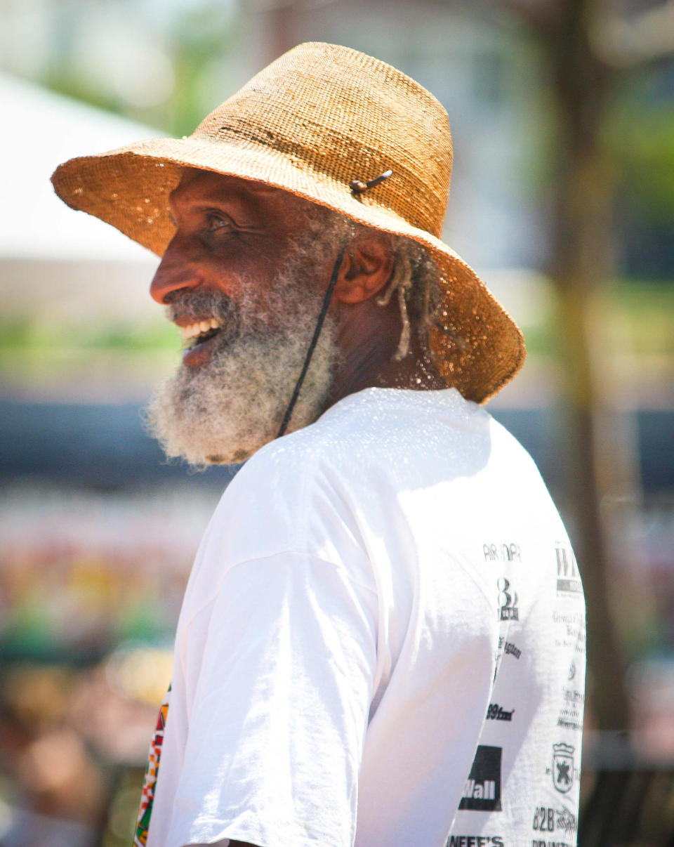 Ibis Pitts, a friend of Bob Marley, chats in 2011 with festivalgoers at the Peoples Festival at Tubman-Garrett Riverfront Park in Wilmington.