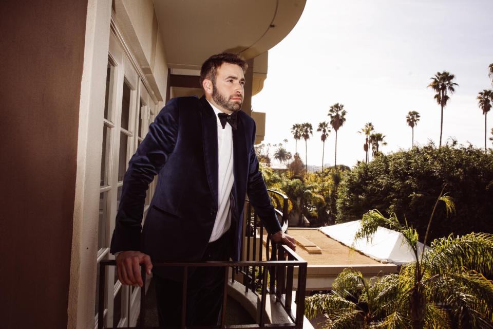 Ronald Gladden in a tuxedo, on the balcony of a Beverly Hills hotel room.