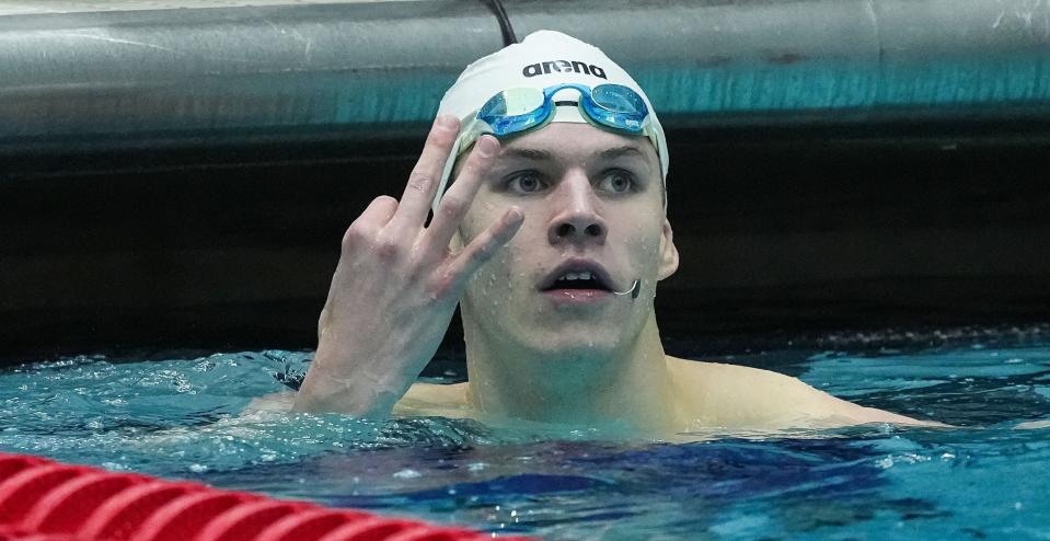 Zionsville Will Modglin holds up three fingers after winning the 200 yard individual medley during the IHSAA swimming and diving state finals on Saturday, Feb. 25, 2023 at IIUPUI Natatorium in Indianapolis. 