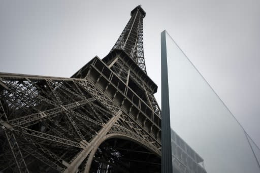 The new glass walls around the Eiffel Tower are part of security measures that have cost nearly 35 million euros