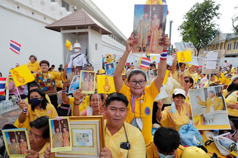 Supporters of Thailand's King Maha Vajiralongkorn and Queen Suthida gather at The Grand Palace in Bangkok