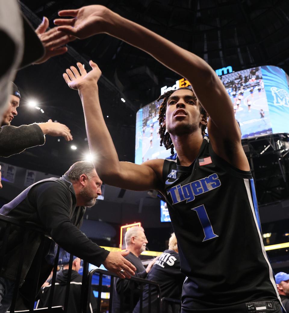 Memphis Tigers guard Emoni Bates high-fives fans after their 71-54 win over the East Carolina Pirates at FedExForum on Thursday, Jan. 27, 2022. 