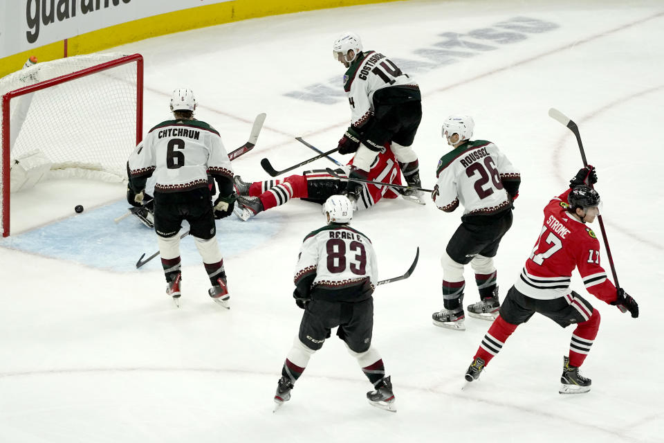 Chicago Blackhawks' Dylan Strome (17) celebrates his goal during the third period of an NHL hockey game against the Arizona Coyotes Friday, Nov. 12, 2021, in Chicago. The Blackhawks won 2-1. (AP Photo/Charles Rex Arbogast)