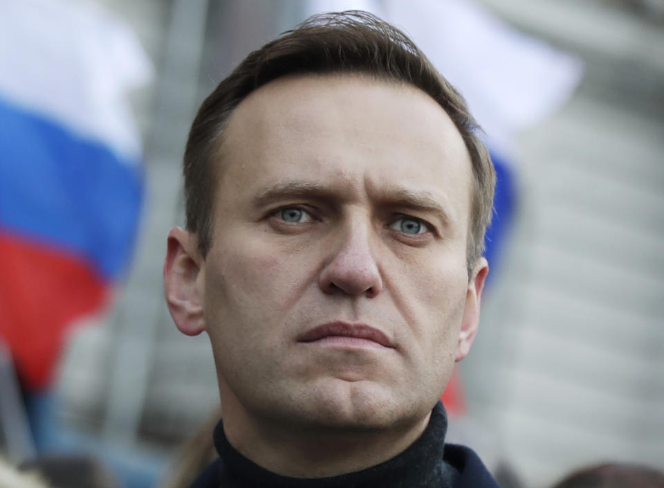 FILE - Russian opposition activist Alexei Navalny takes part in a march in memory of opposition leader Boris Nemtsov in Moscow, Russia, on Feb. 29, 2020. Navalny is due to hear the verdict Friday Aug. 4, 2023 in his latest trial on extremism charges. The prosecution has demanded a 20-year prison sentence, and the politician himself said he expects a lengthy prison term. (AP Photo/Pavel Golovkin, File)