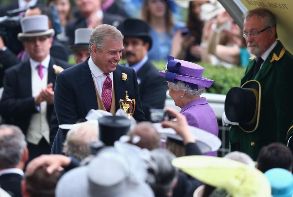 <div class="inline-image__caption"><p>Prince Andrew presents Queen Elizabeth with a trophy after the her horse won The Gold Cup on Ladies' Day during Royal Ascot on June 20, 2013.</p></div> <div class="inline-image__credit">Paul Gilham/Getty</div>