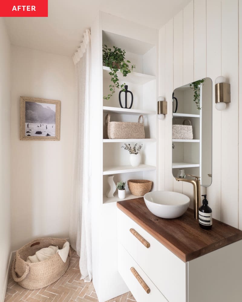 Apartment bathroom after renovation. Lots of white, natural wood, natural colors