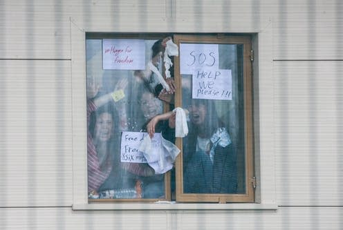 <span class="caption">Detainees in Yarl's Wood Immigration Removal Centre hold up signs calling for help during anti-detention demonstration</span> <span class="attribution"><a class="link " href="https://www.alamy.com/milton-ernest-uk-24th-march-2018-detainees-inside-yarls-wood-immigration-removal-centre-wave-to-and-hold-messages-for-hundreds-of-anti-detention-image178003815.html?pv=1&stamp=2&imageid=C5DFB505-6604-40F5-A06E-C11FC8062DB0&p=278138&n=60&orientation=0&pn=1&searchtype=0&IsFromSearch=1&srch=foo%3Dbar%26st%3D0%26sortby%3D2%26qt%3Dyarl%27s%2520wood%26qt_raw%3Dyarl%27s%2520wood%26qn%3D%26lic%3D3%26edrf%3D0%26mr%3D0%26pr%3D0%26aoa%3D1%26creative%3D%26videos%3D%26nu%3D%26ccc%3D%26bespoke%3D%26apalib%3D%26ag%3D0%26hc%3D0%26et%3D0x000000000000000000000%26vp%3D0%26loc%3D2%26ot%3D0%26imgt%3D0%26dtfr%3D%26dtto%3D%26size%3D0xFF%26blackwhite%3D%26cutout%3D%26archive%3D1%26name%3D%26groupid%3D%26pseudoid%3D%26userid%3D%26id%3D%26a%3D%26xstx%3D0%26cbstore%3D1%26resultview%3DsortbyPopular%26lightbox%3D%26gname%3D%26gtype%3D%26apalic%3D%26tbar%3D1%26pc%3D%26simid%3D%26cap%3D1%26customgeoip%3DGB%26vd%3D0%26cid%3D%26pe%3D%26so%3D%26lb%3D%26pl%3D0%26plno%3D%26fi%3D0%26langcode%3Den%26upl%3D0%26cufr%3D%26cuto%3D%26howler%3D%26cvrem%3D0%26cvtype%3D0%26cvloc%3D0%26cl%3D0%26upfr%3D%26upto%3D%26primcat%3D%26seccat%3D%26cvcategory%3D*%26restriction%3D%26random%3D%26ispremium%3D1%26flip%3D0%26contributorqt%3D%26plgalleryno%3D%26plpublic%3D0%26viewaspublic%3D0%26isplcurate%3D0%26imageurl%3D%26saveQry%3D%26editorial%3D%26t%3D0%26filters%3D1" rel="nofollow noopener" target="_blank" data-ylk="slk:Mark Kerrison/Alamy;elm:context_link;itc:0;sec:content-canvas">Mark Kerrison/Alamy</a></span>