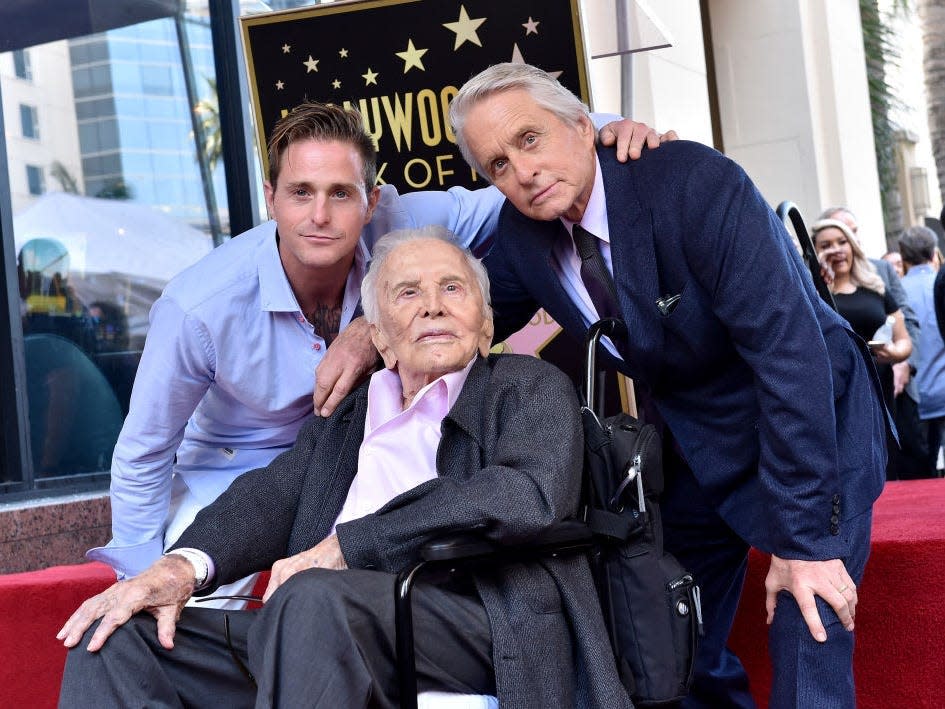 Cameron Douglas, Kirk Douglas, and Michael Douglas are pictured together.