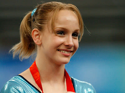 Gymnist Sandra Izbasa has definitely got the balance right between her excellent gymnastics career and looking gorgeous.