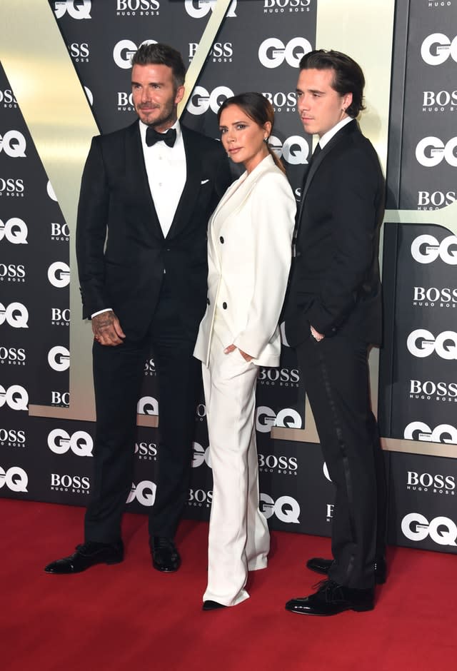 David, Victoria And Brooklyn Beckham Wear Suits For GQ Awards